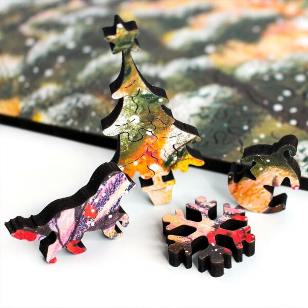 happy winter christmas jigsaw puzzle showing whimsy pieces shaped like a labrador a christmas tree a snowflake and a christmas bubble